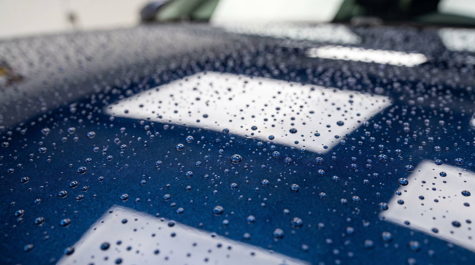 Water beading tightly on a ceramic coated car hood at MDM Auto Detail Richmond Hill